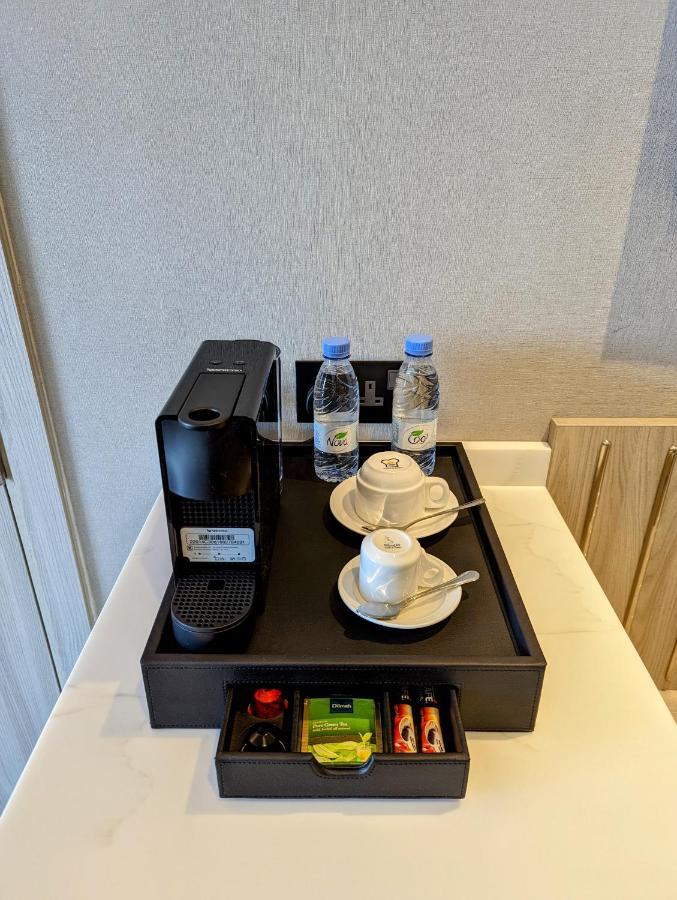 Citadines Abha Apart otel Dış mekan fotoğraf A Nespresso coffee machine in a hotel room